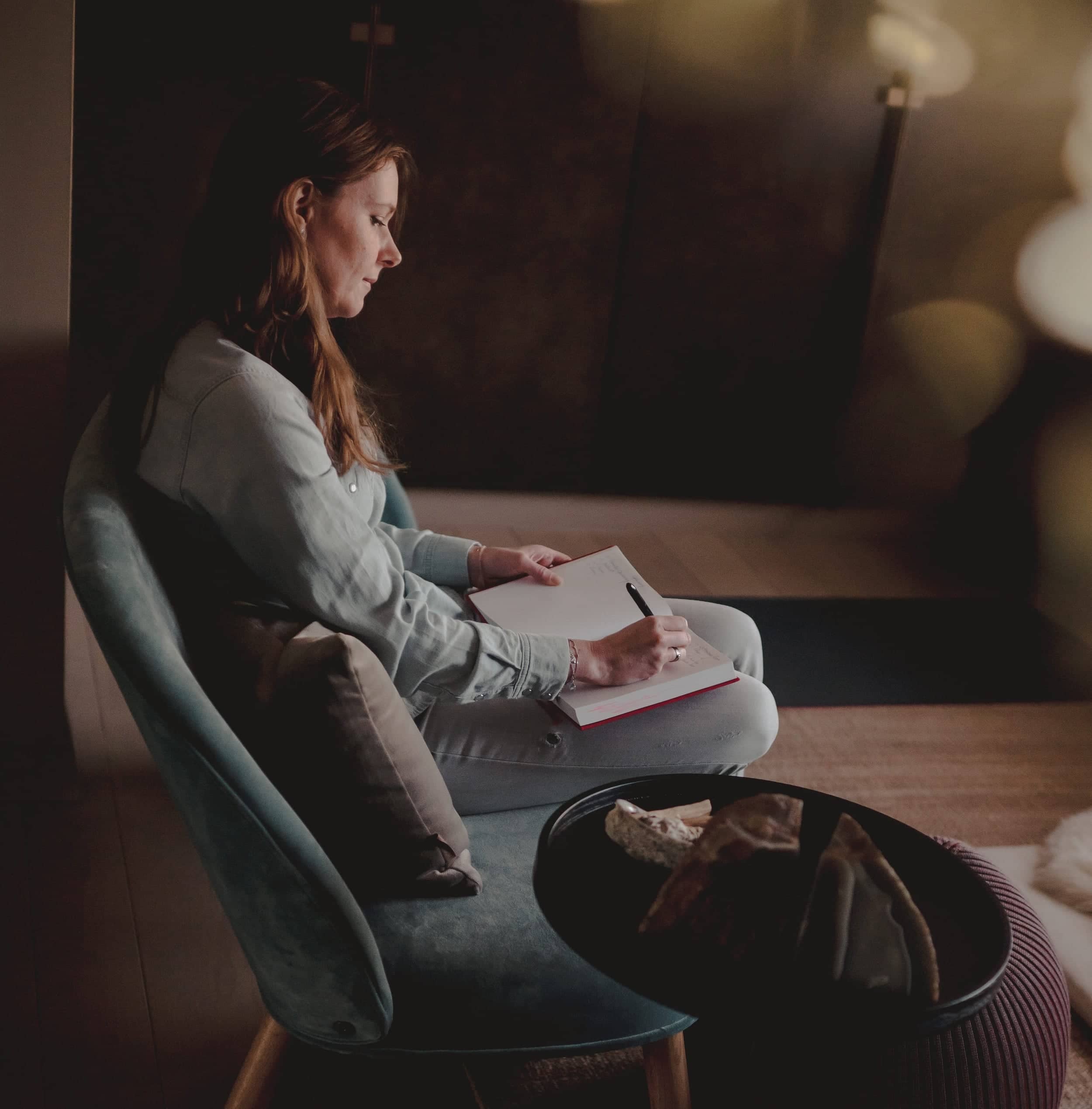 Haike writing in her notebook